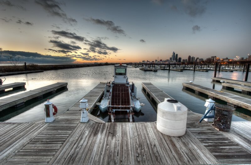 Dock at sunset with city skyline