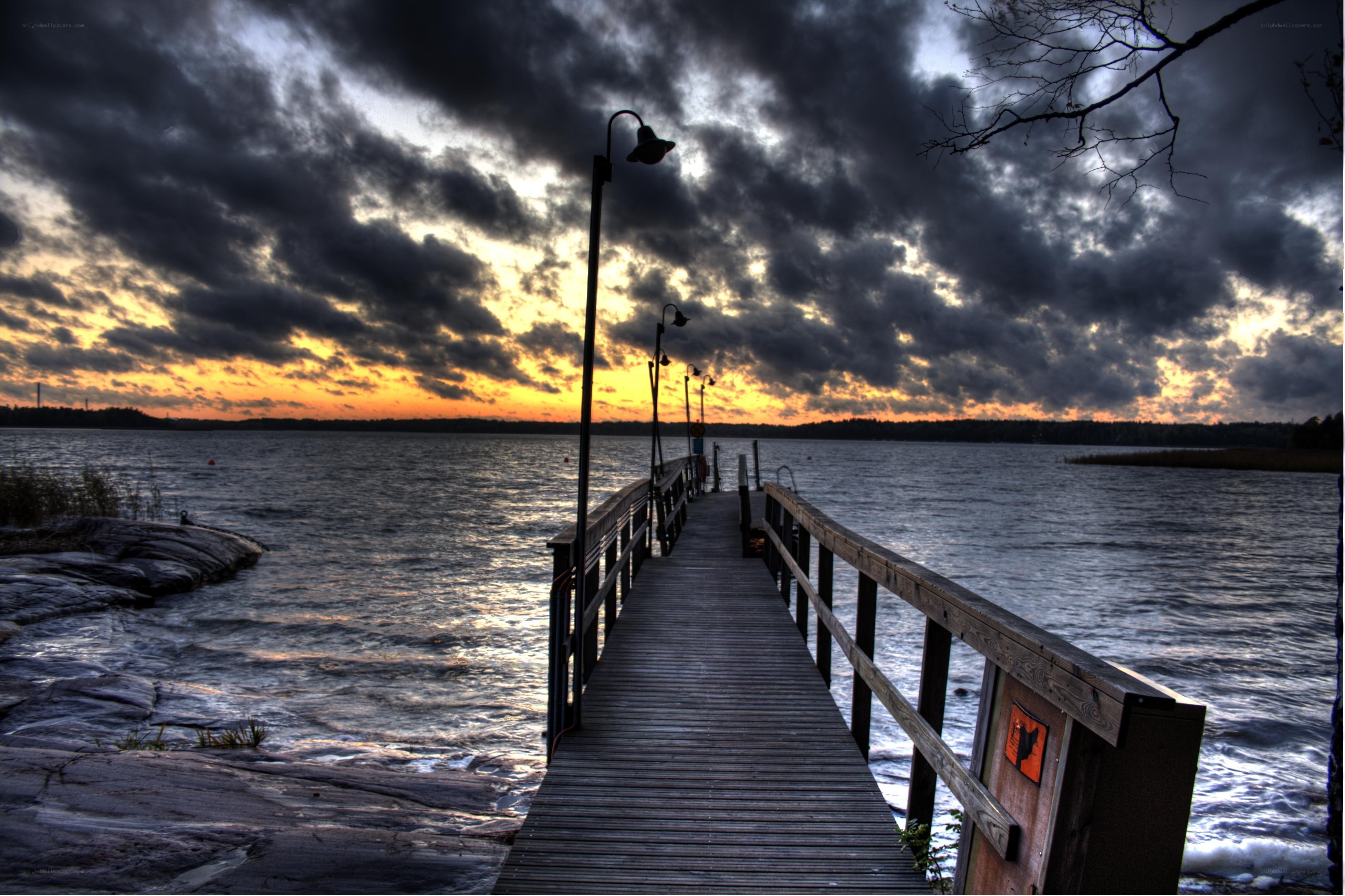Dock at sunset with stormy sky