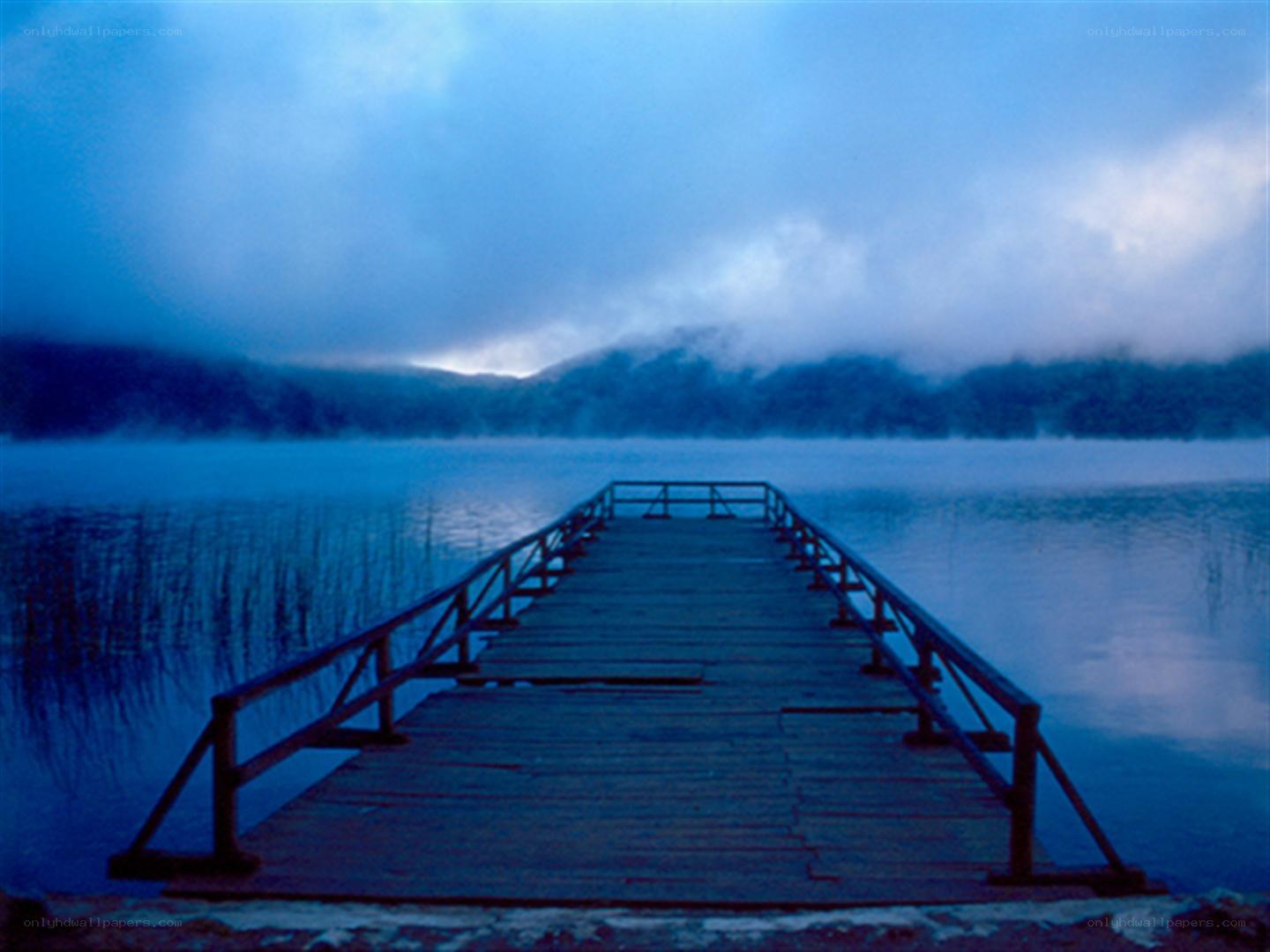 Dock on a misty lake