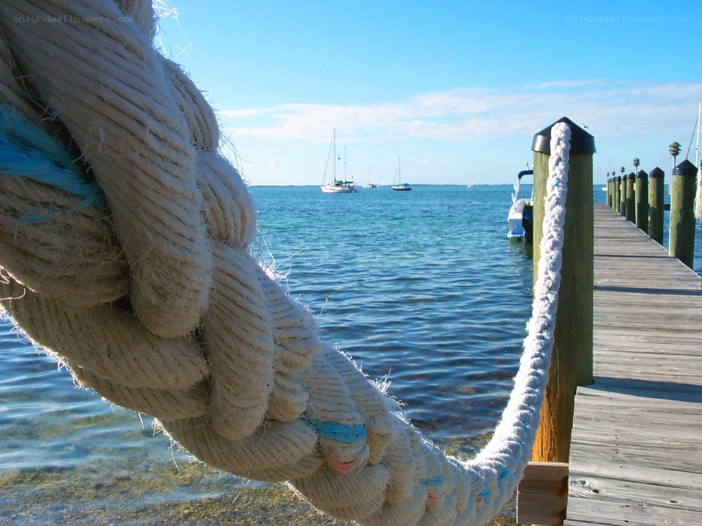 Dock with rope and sailboats