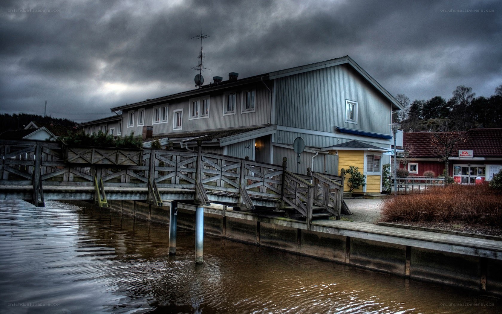 Dockside building under stormy sky