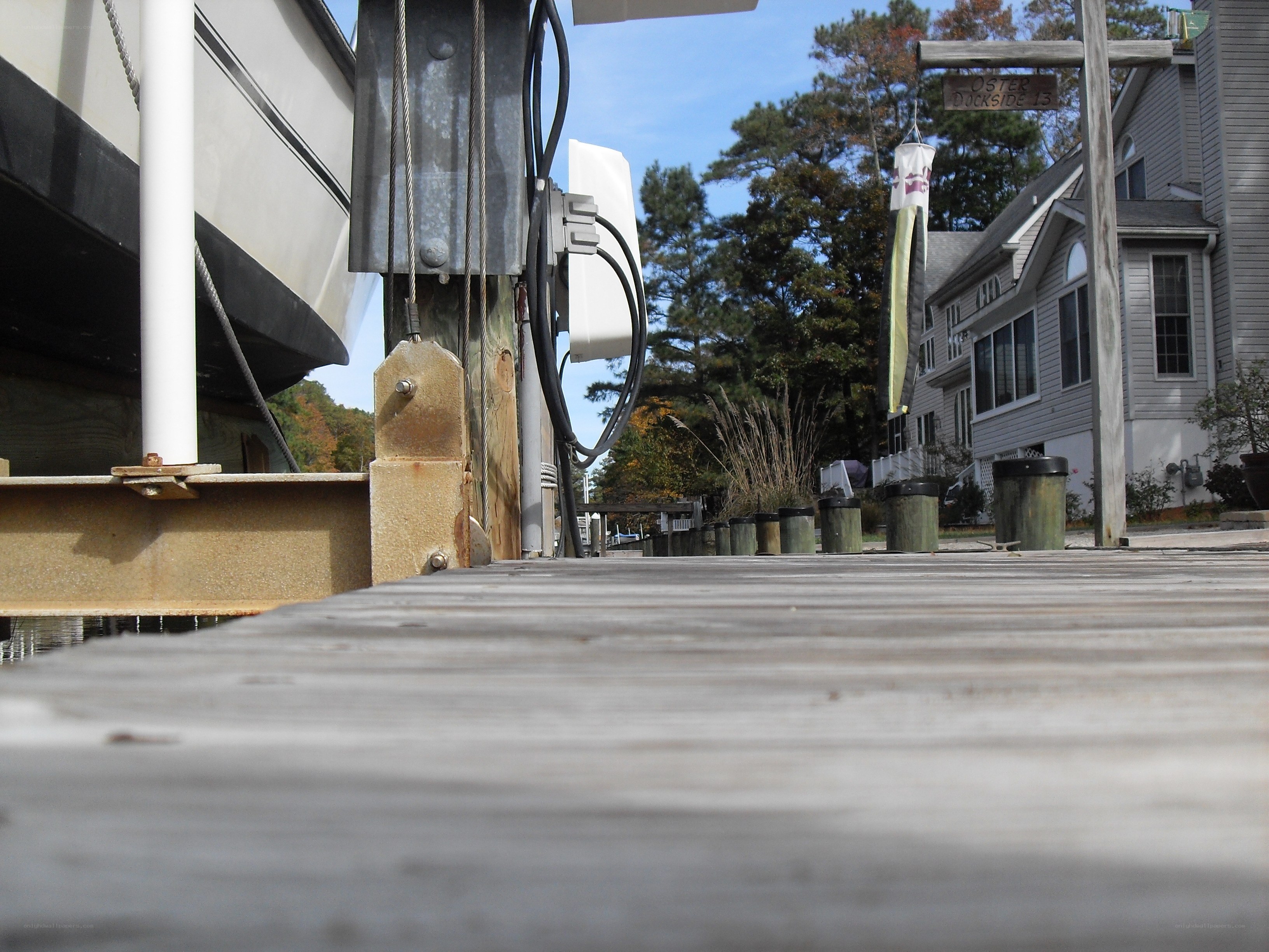 Dockside view with boat and house