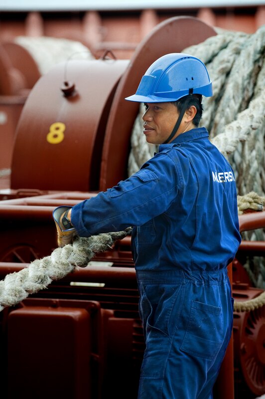 Dockworker handling rope
