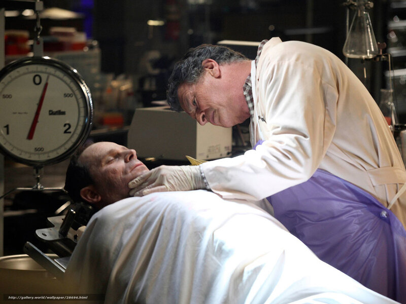 Doctor examining patient in lab