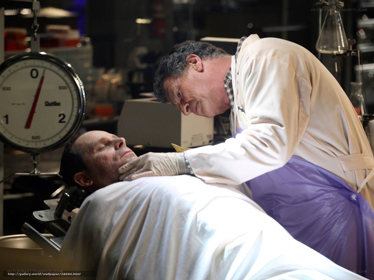Doctor examining patient in lab