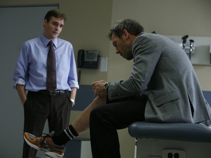 Doctor examining patient's leg