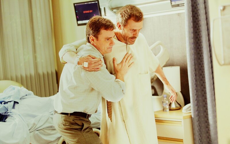 doctor helping patient in hospital