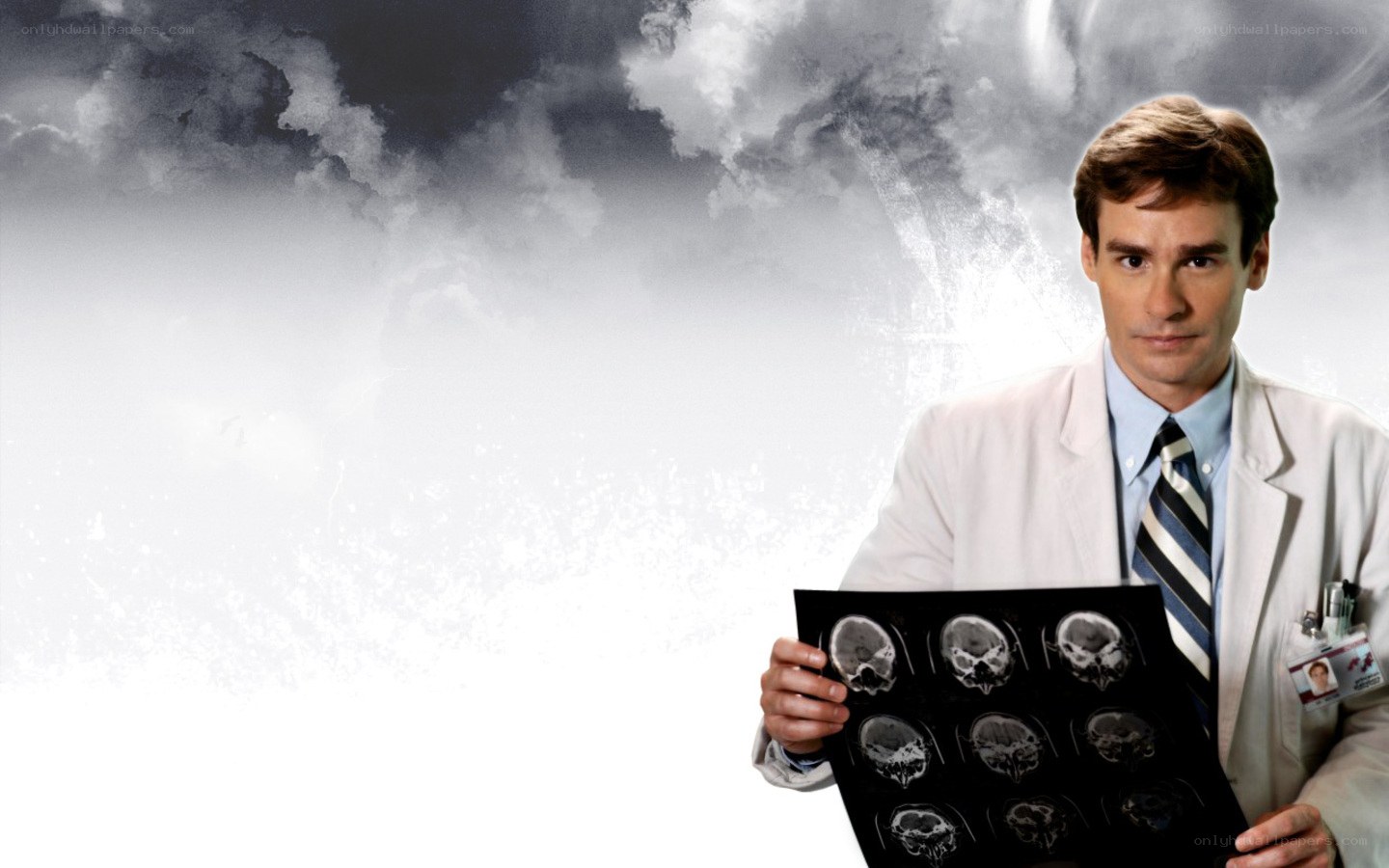 doctor holding brain scans