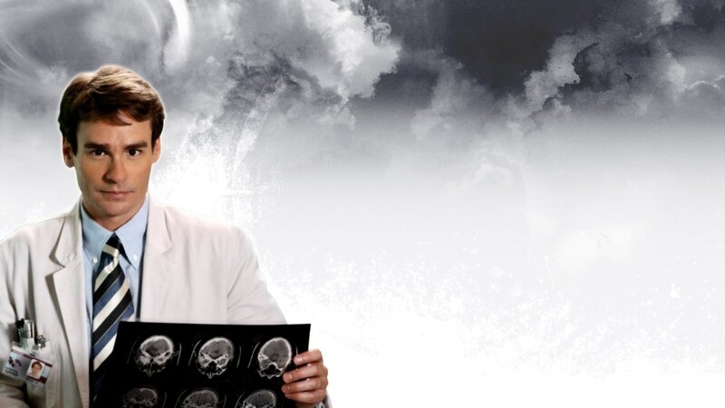 Doctor holding brain scans