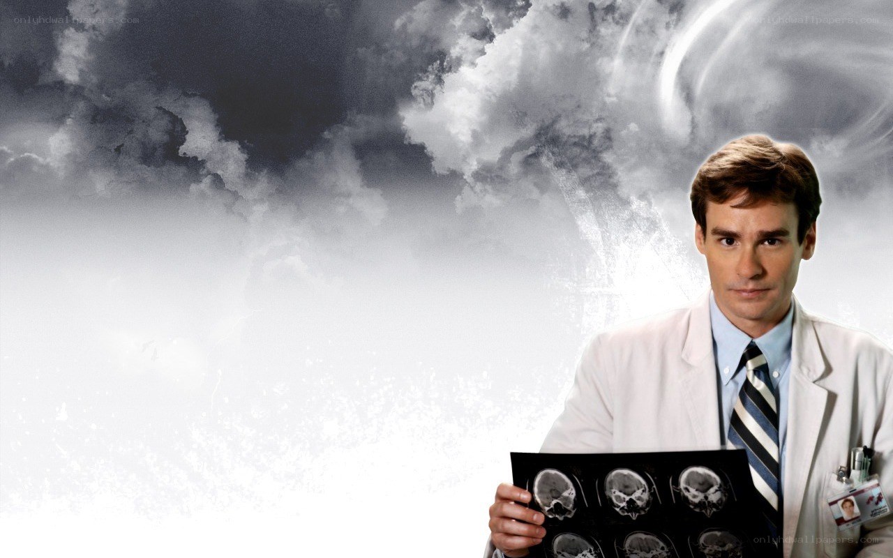doctor holding brain scans