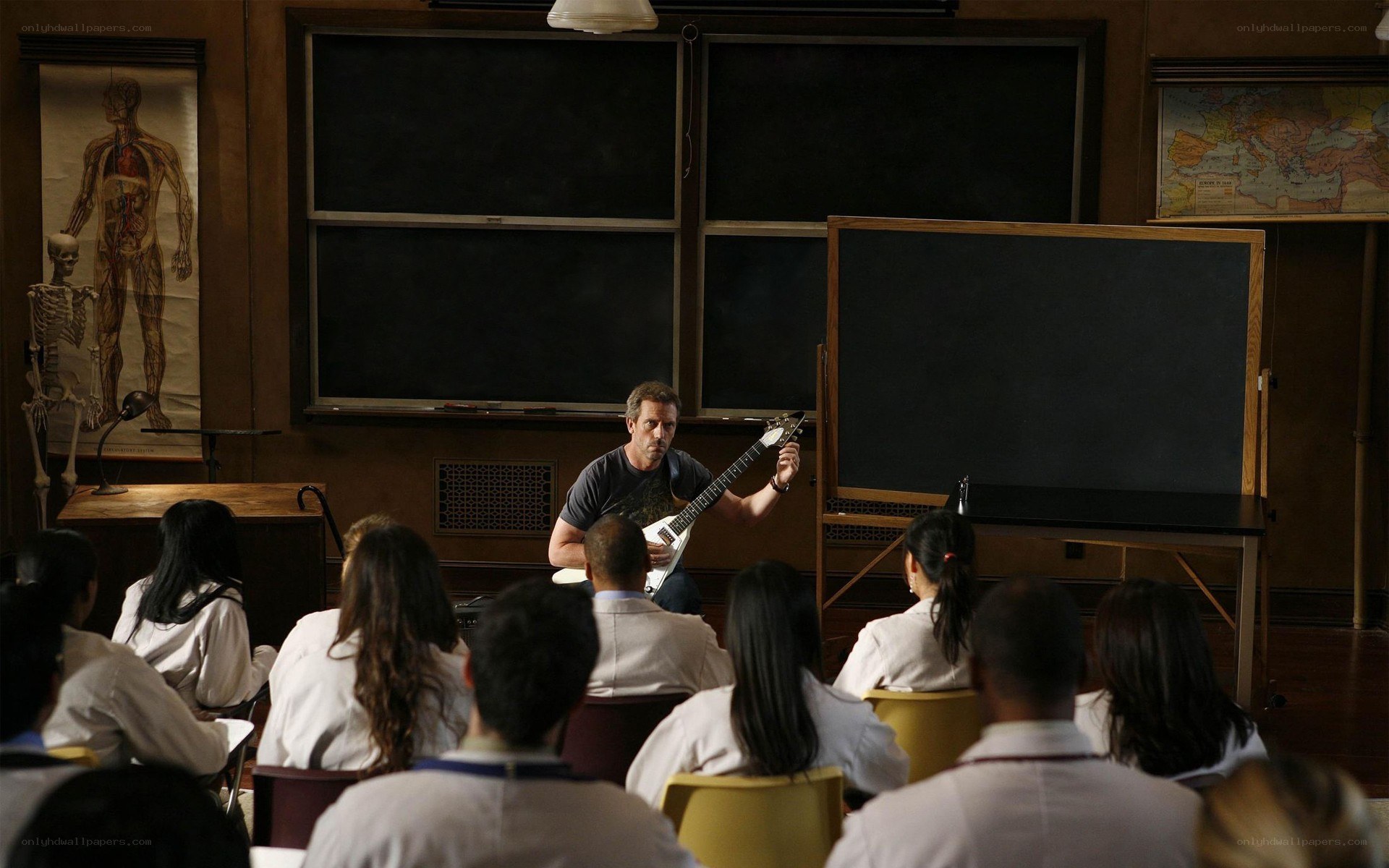 Doctor teaching with guitar