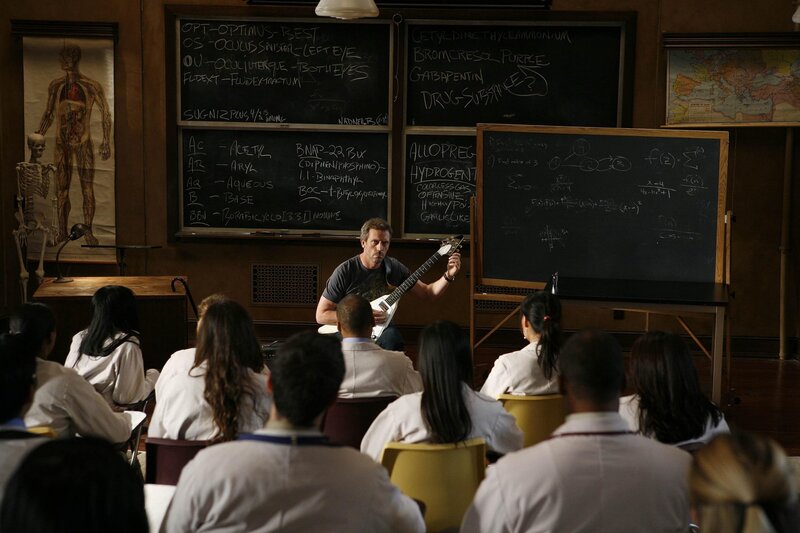 Doctor teaching with guitar