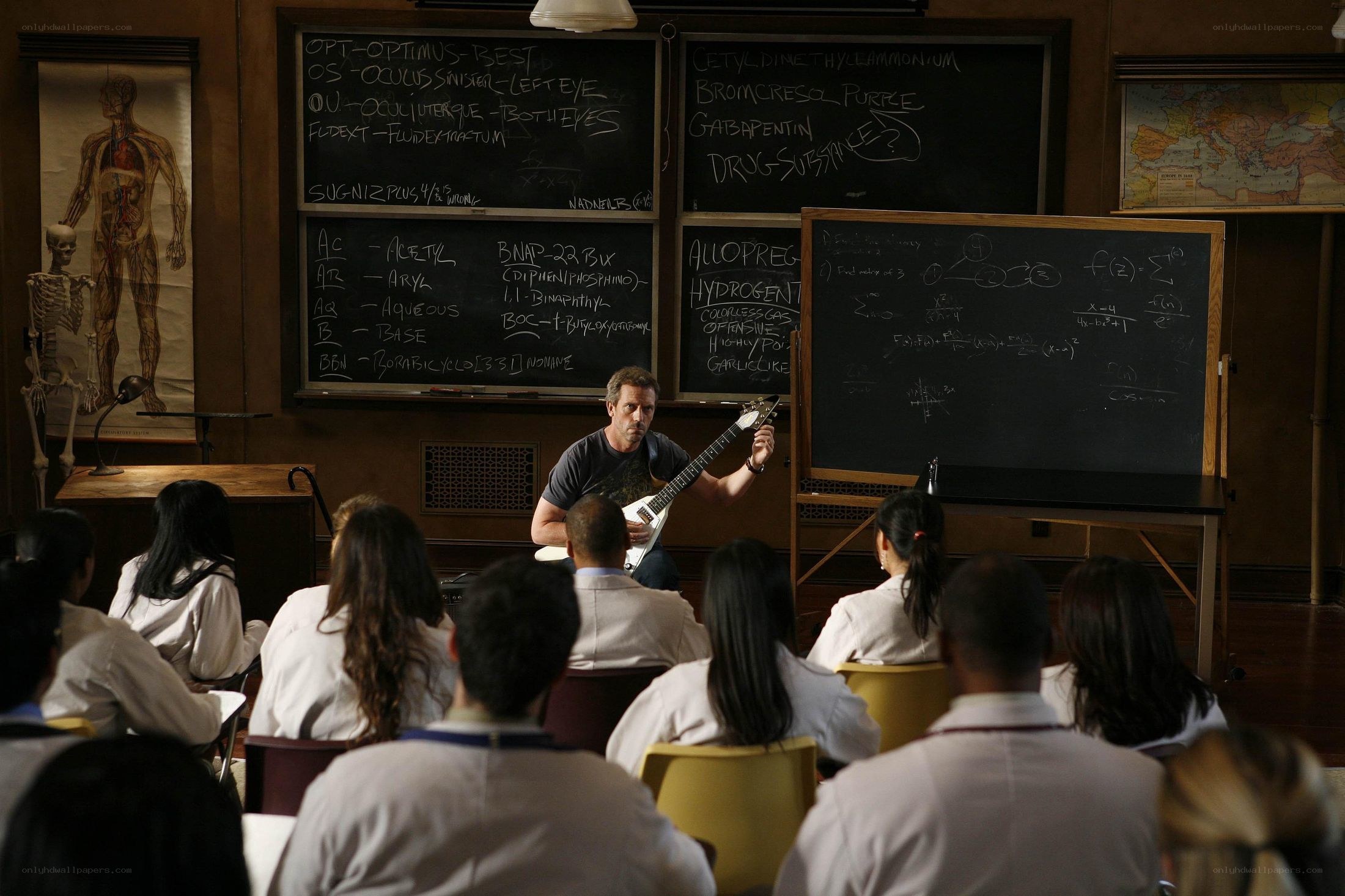 Doctor teaching with guitar