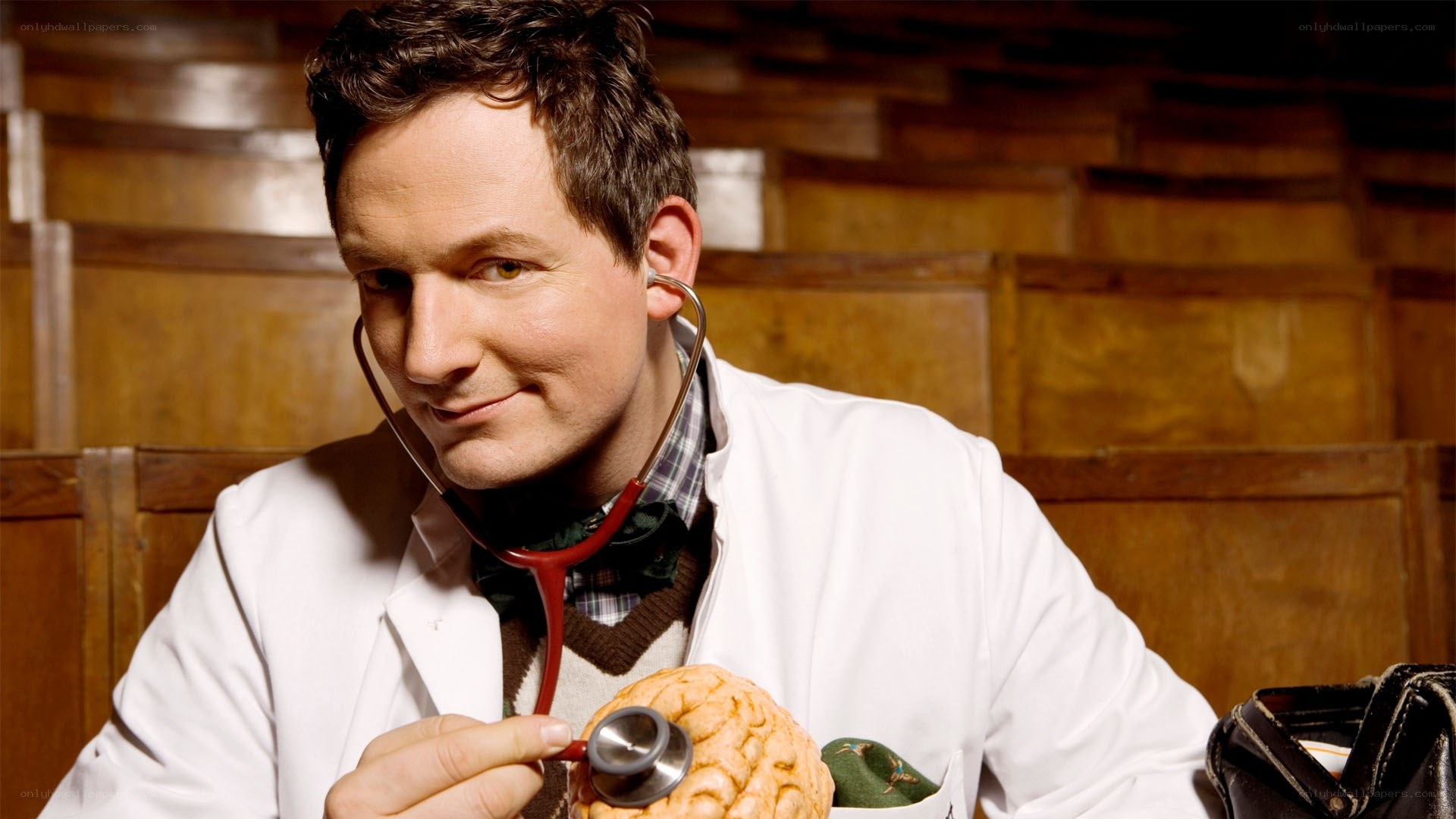 doctor with stethoscope and brain model