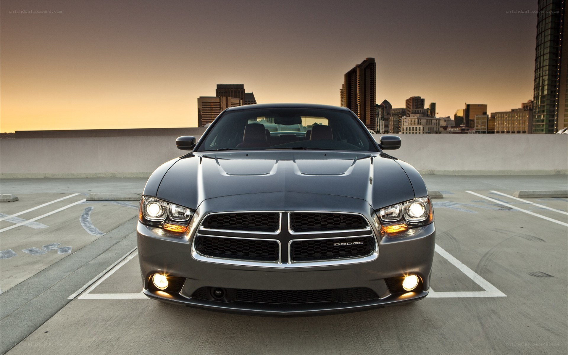 Dodge Charger on rooftop at sunset