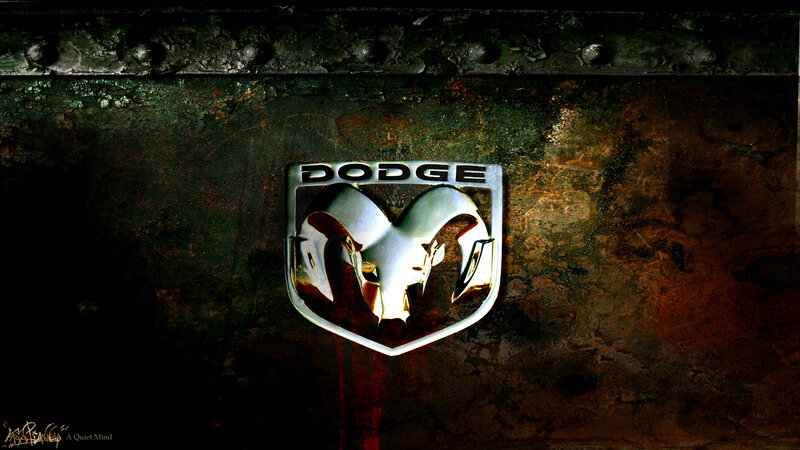 Dodge Ram emblem on rusted metal