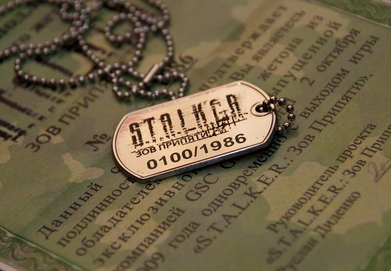 Dog Tag on Document — Green, Serious
