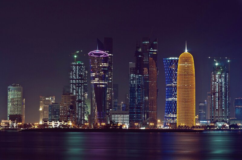 Doha Skyline at Night — Black, Dramatic, Photograph, Skyscrapers, Water, City Lights