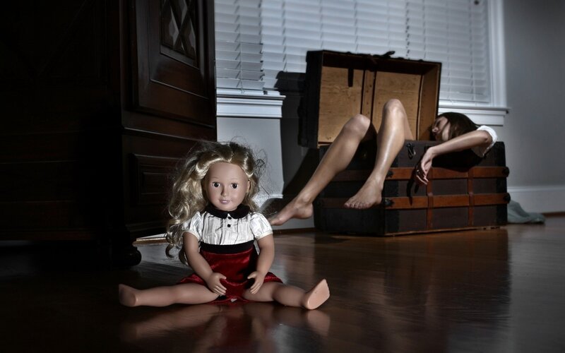 doll and woman in trunk