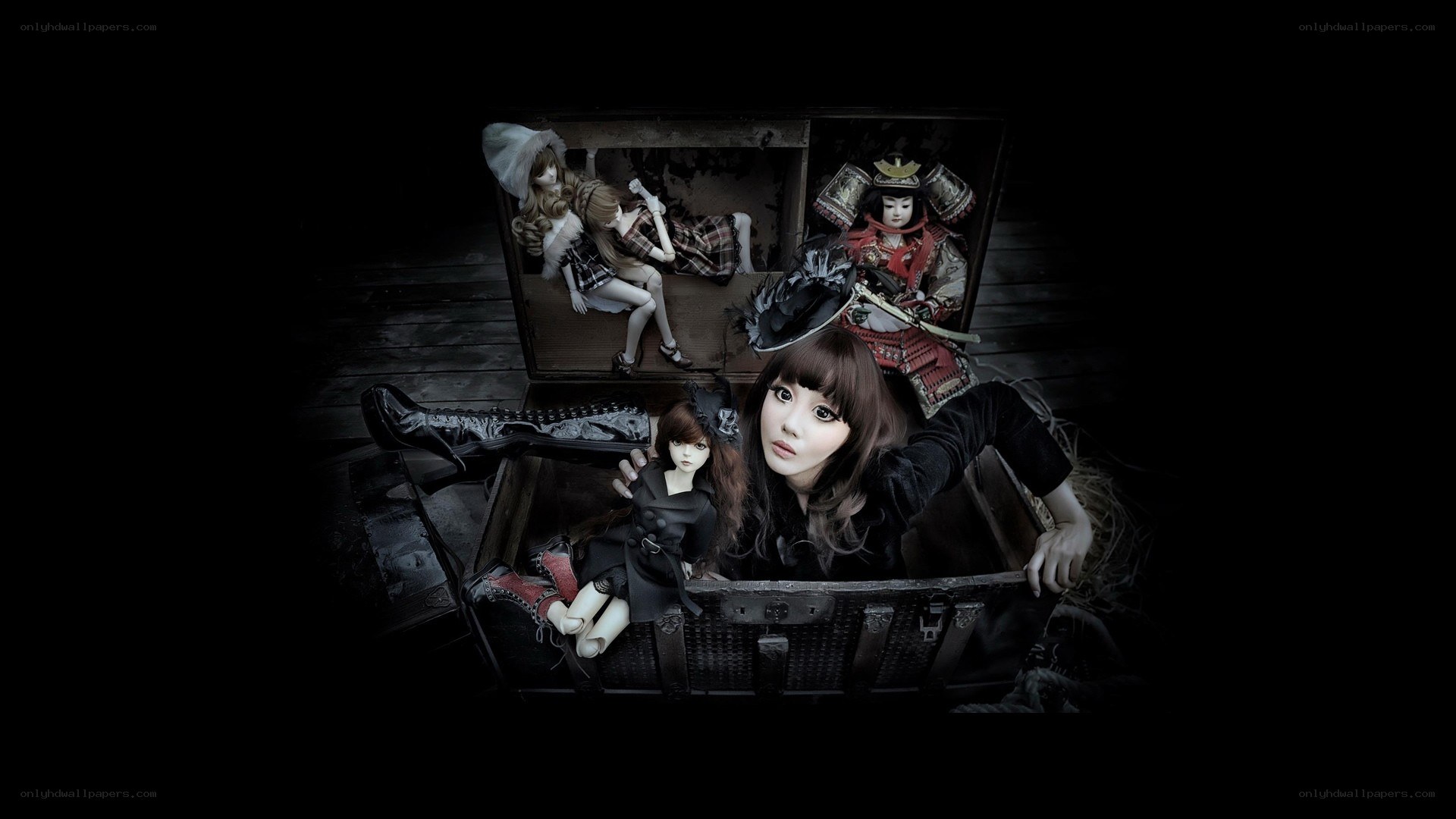doll collection in a chest