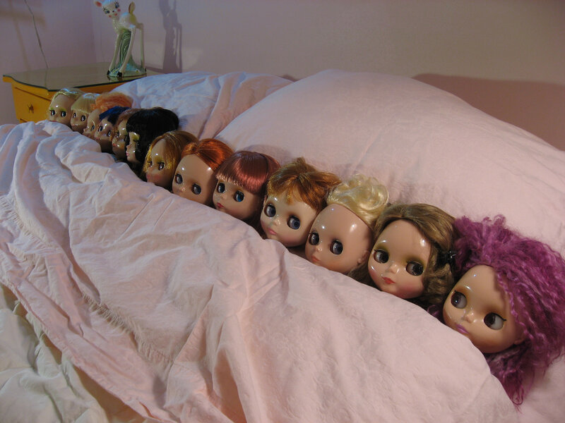 Doll Heads in Bed