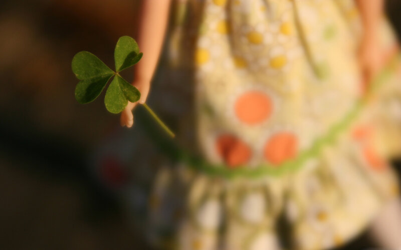Doll Holding Clover