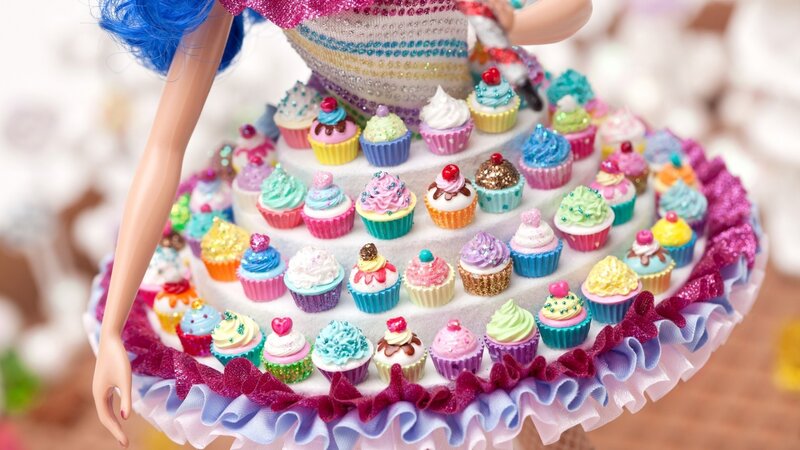 Doll Holding Cupcake Stand