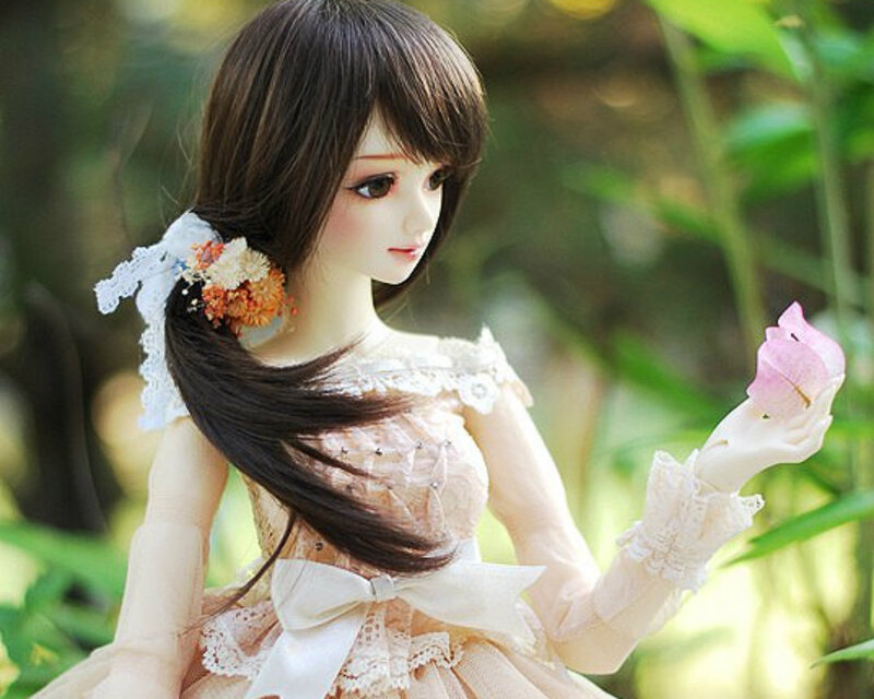 Doll Holding Flower