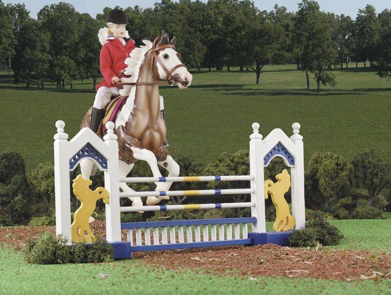 doll horse jumping over hurdle