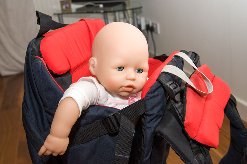 Doll in Carrier Seat