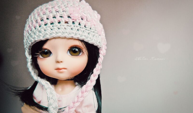 doll in crocheted hat