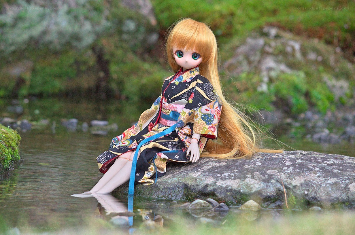 doll in kimono by stream