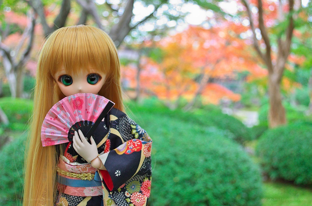 doll in kimono with fan
