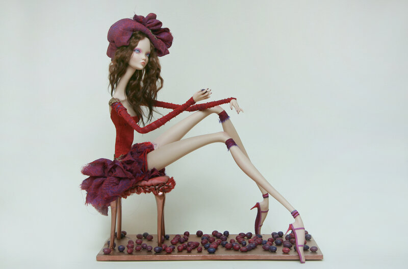 Doll in red dress sculpture