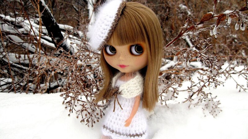 doll in snowy landscape