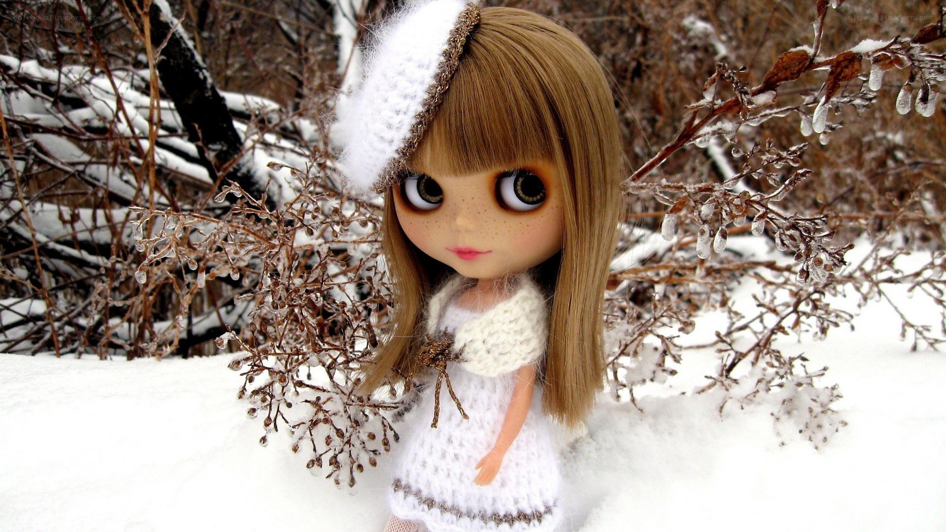 doll in snowy landscape