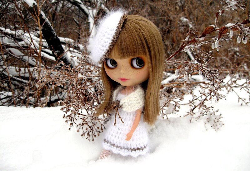 doll in snowy landscape
