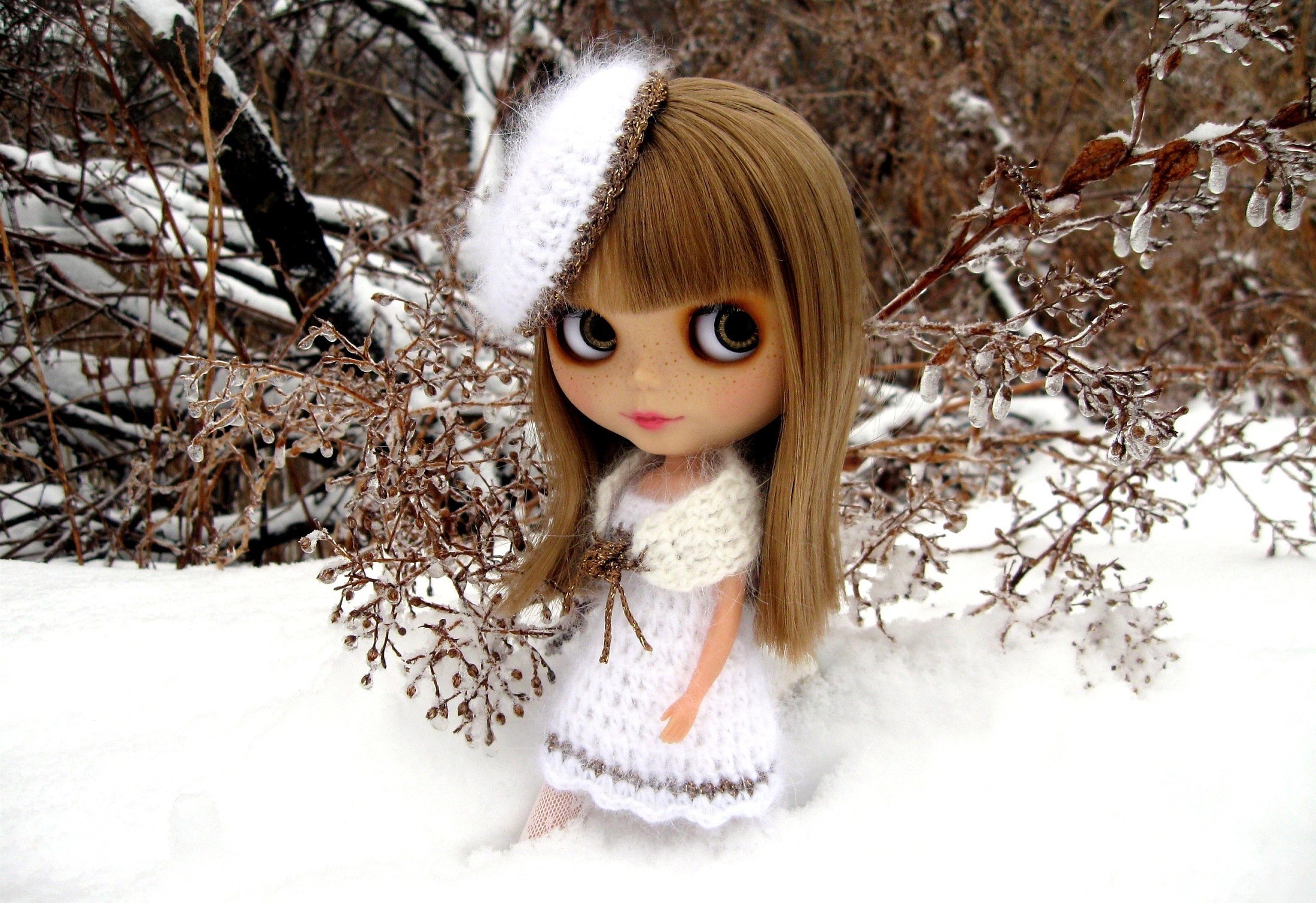 doll in snowy landscape