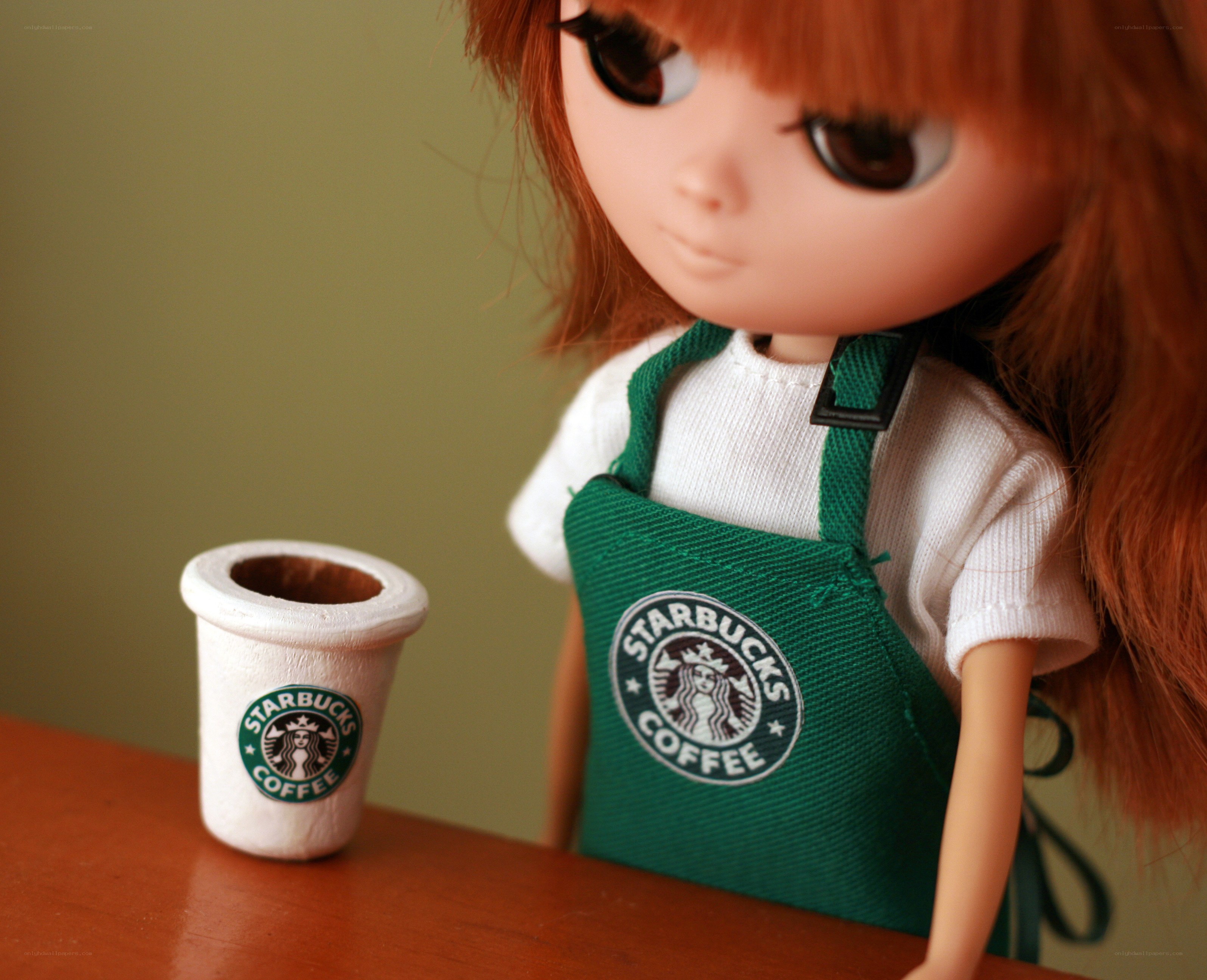 doll in starbucks apron