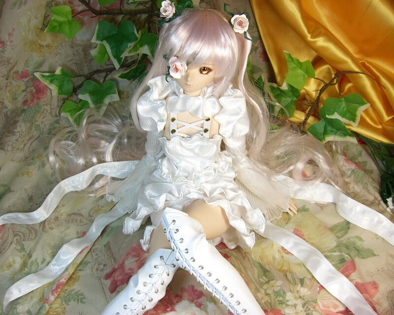 doll in white dress with flowers