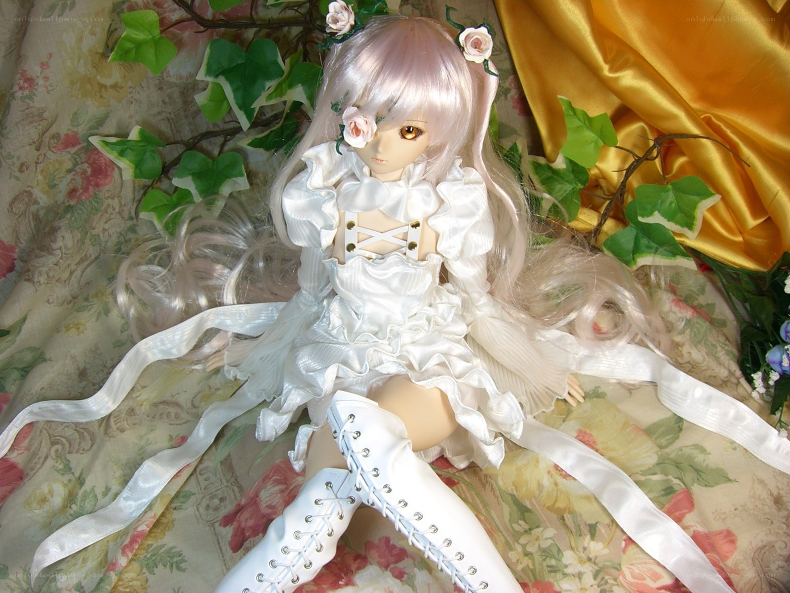 doll in white dress with flowers