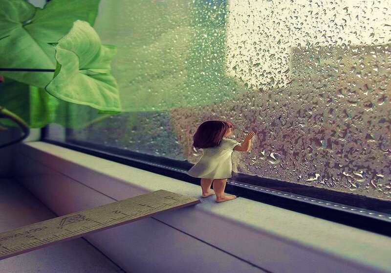 doll looking out rainy window