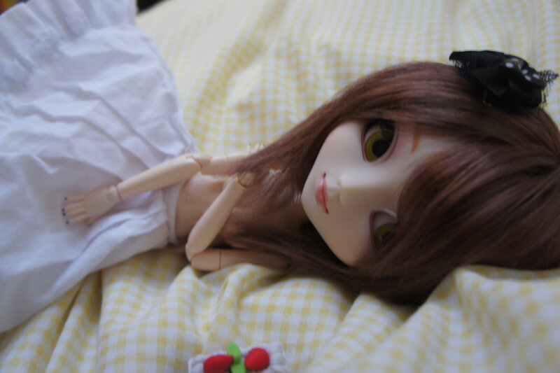 Doll Lying on Bed