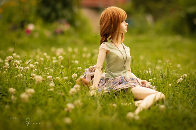 Doll Sitting in Grass