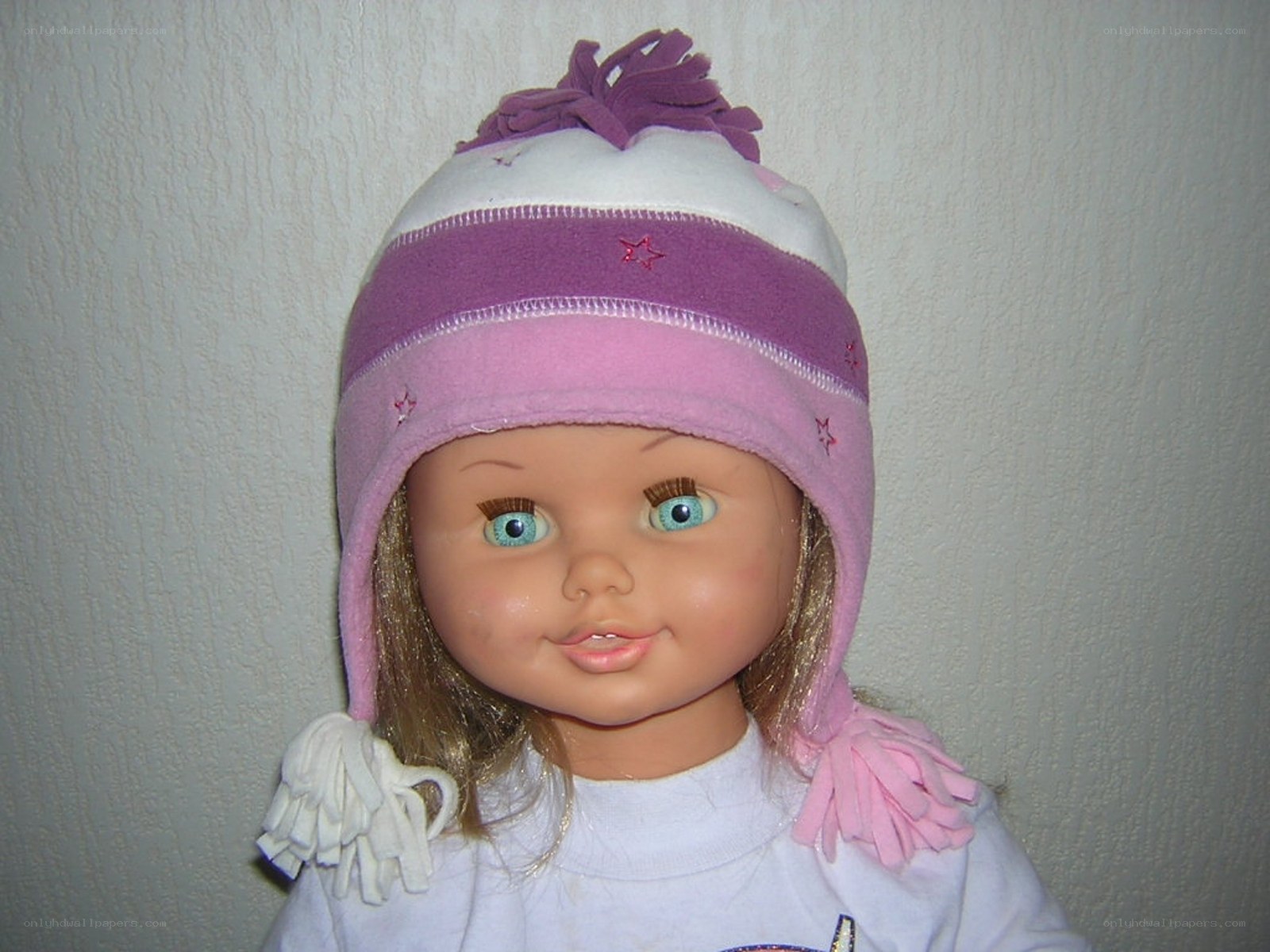 doll wearing a winter hat