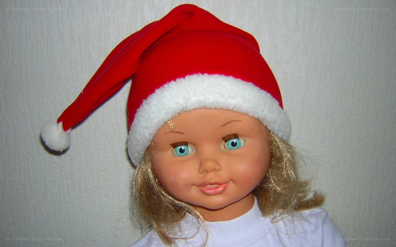 doll wearing santa hat