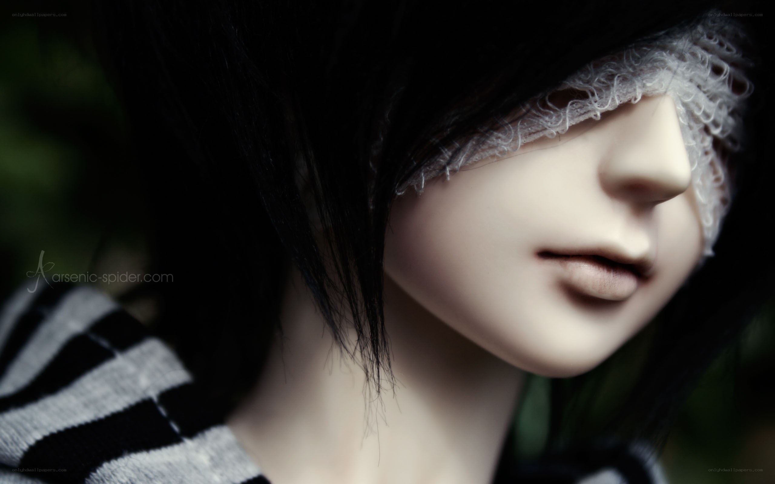 doll with blindfolded eyes