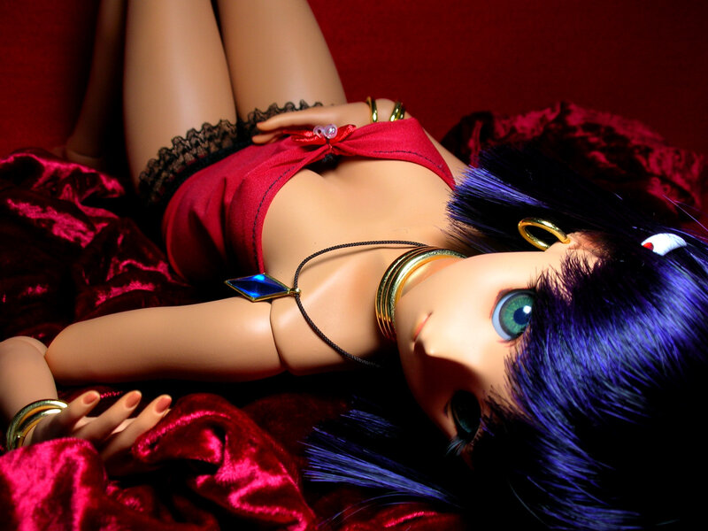 doll with blue hair and red outfit