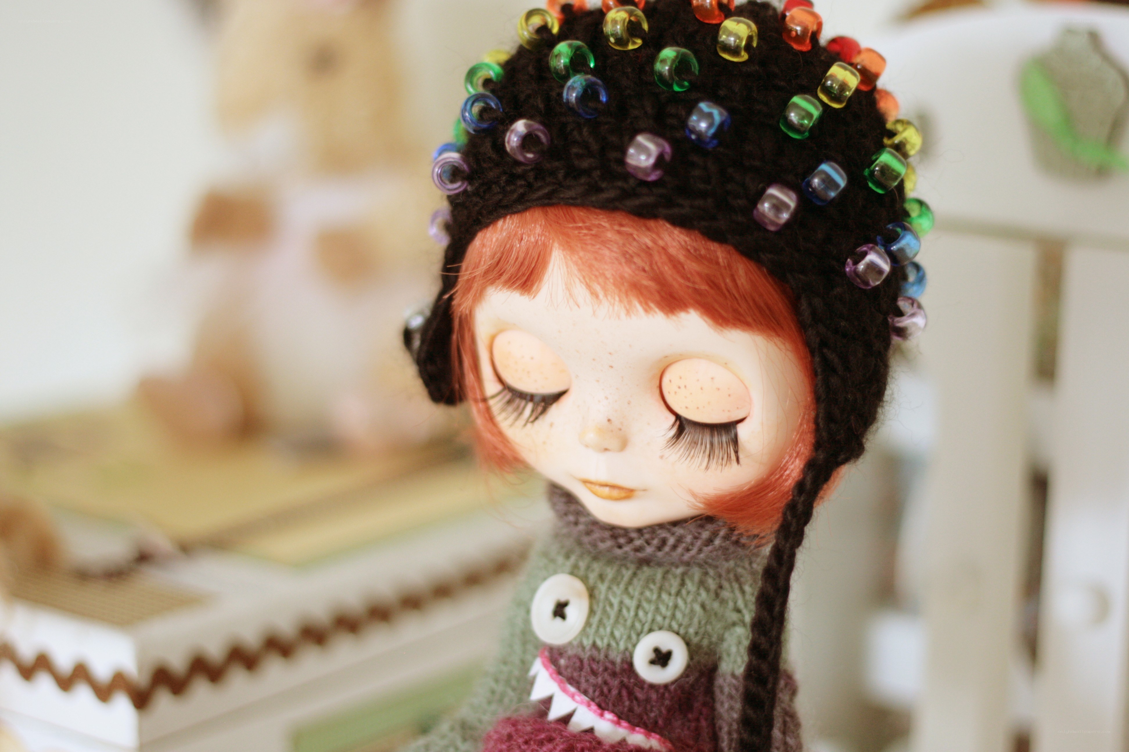 doll with colorful beaded hat