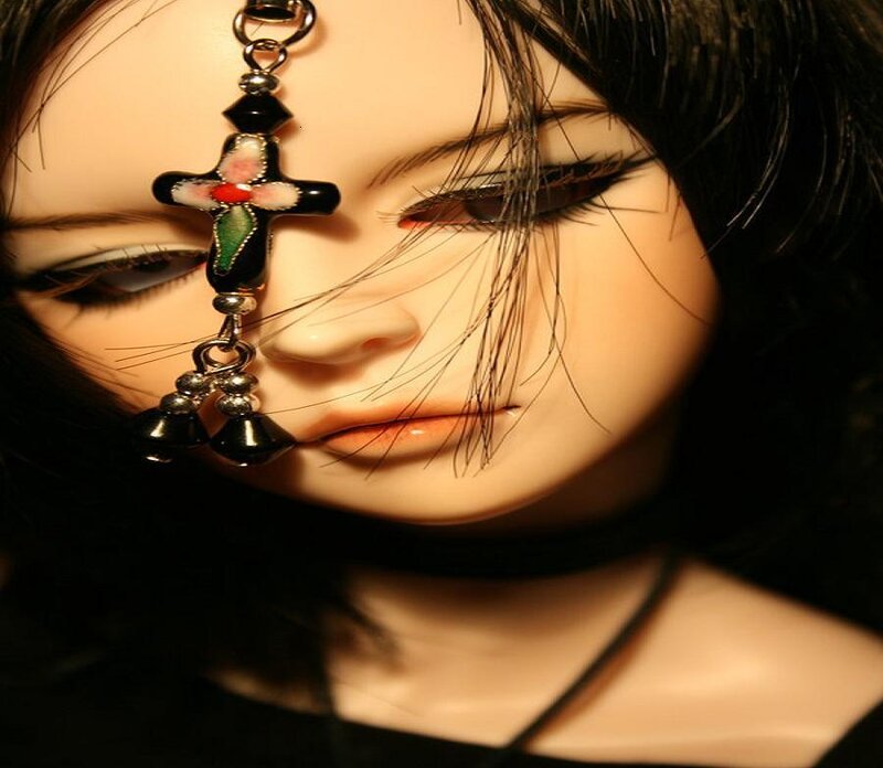 doll with cross earring